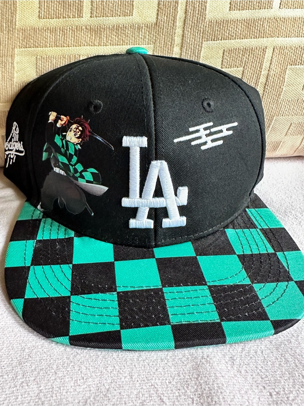 LA Embroidered Checkerboard Snapback Hat in Black & Teal